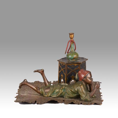 Cold-Painted Austrian Bronze entitled "Boy on Rug Inkwell" by Franz Bergman
