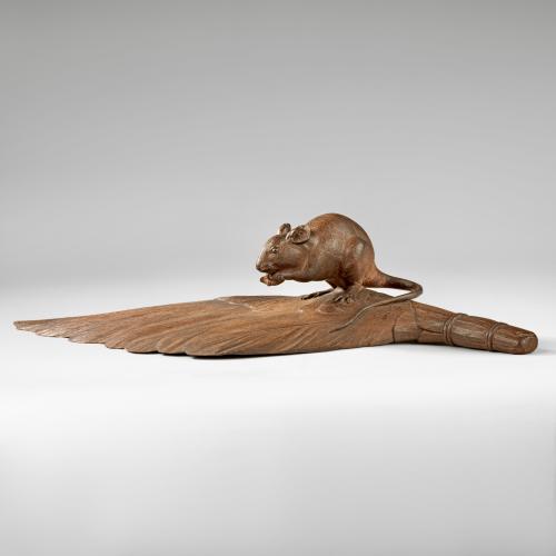 Japanese wood rat standing on a feather-brush signed Hosei, Meiji Period