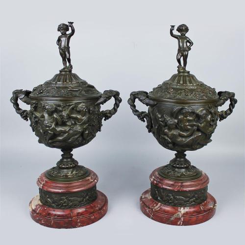 A Pair of Patinated Bronze and Rouge Griotte Marble Urns and Covers, In The Manner of Clodion