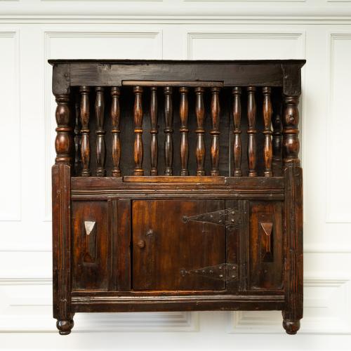 A rare, small, Charles II fruitwood mural ventilated livery cupboard, circa 1660