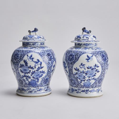 An attractive 19th Century pair of blue and white covered jars (Circa 1860)
