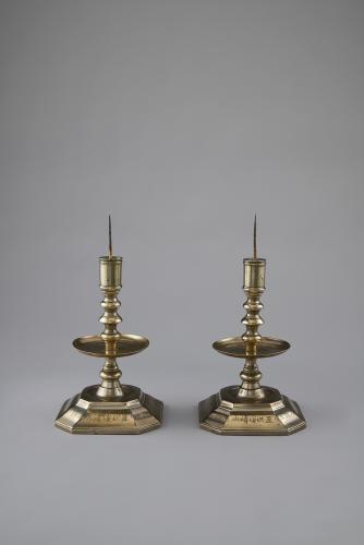 A pair of baitong (white brass) pricket candlesticks, Chinese, Qing dynasty, dated 1850
