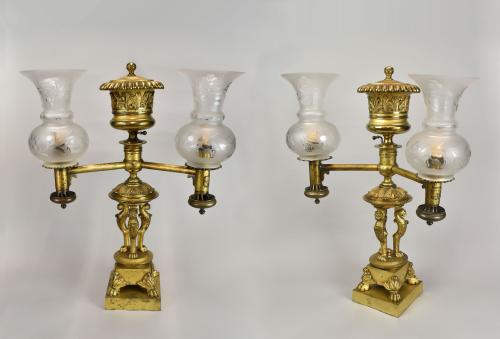 A fine pair of Regency Argand lamps retaining the original gilt lacquer finish and the trade label of J. Deville, 367 Strand, London, c.1815.