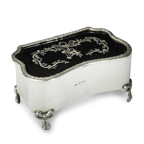 Edwardian shaped rectangular silver and tortoiseshell piqué box