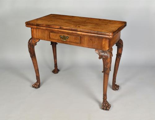 A finely carved Irish walnut cabriole leg card table, circa 1740