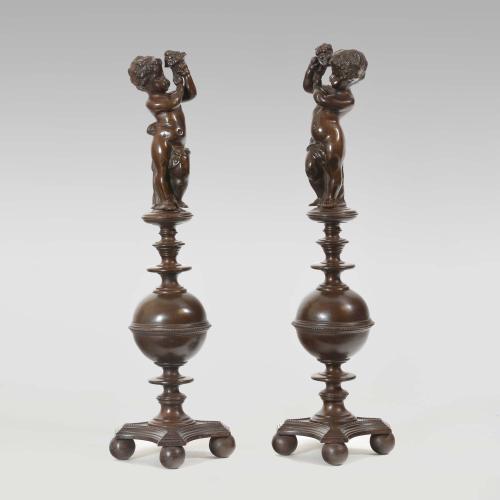 A pair of bronzed cast iron Renaissance style andirons