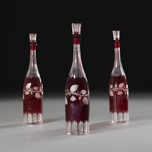 A Set of Three Red 19th Century Spirit Decanters