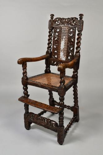 A rare William and Mary walnut child’s high chair carved with ‘boyes and a crown’, c.1690