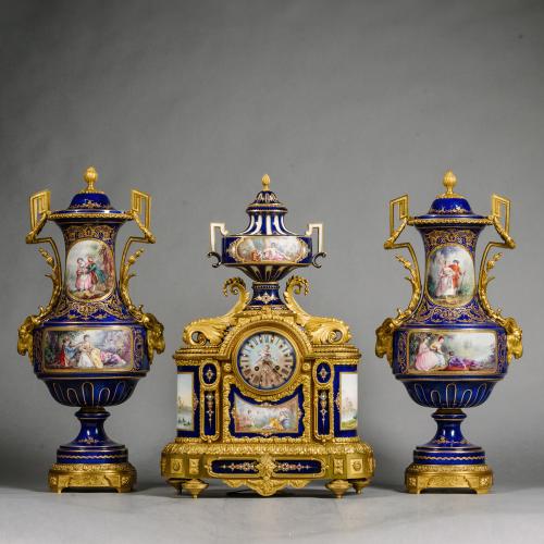A Large Sèvres Style Porcelain Three-Piece Clock Garniture