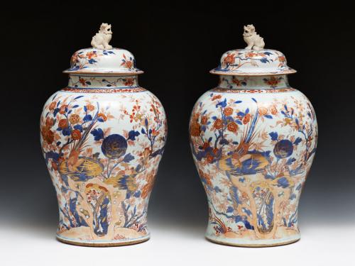 174. Large pair of Chinese export porcelain baluster jars and covers decorated in under-glaze cobalt blue (qinghua) and over glaze iron-red and gold (Imari pattern) with two pheasants on rocks amidst luxuriant flowering trees, covers with unglazed Chinese lion finial, c. 1720, Kangxi reign, Qing dynasty, h. 65 cm, 25¾ in. (both covers restored, chip to one rim filled in) Image: 2.13077 Illustrated: 100 Years of Chinese Export Porcelain, by A. Varela Santos, 2014/201
