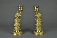 Pair of gilt brass candlesticks of seated Chinamen