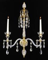 A fine set of four ormolu-mounted cut-glass two-light wall-lights in Adam style