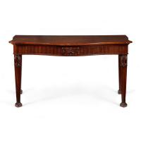 George III serpentine carved mahogany side table in the manner of Robert Adam