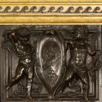 A Patinated Bronze and Sienna Marble Fireplace