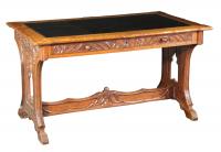 A neo-Gothic carved oak writing table