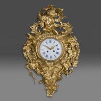 An Elaborate Louis XV Style Gilt-Bronze Cartel Clock
