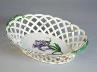 Strasbourg oval faience basket finely painted with a botanical specimen, c.1770.