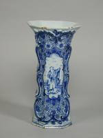 A Garniture of mid 18th century Dutch Delft blue and white vases