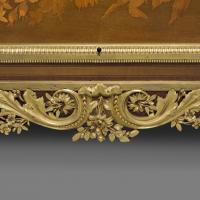 A Louis XVI Style Marquetry Commode after a model by Jean-Henri Riesener, by François Linke