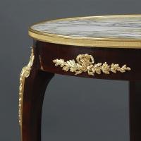 A Louis XV Style Gilt-Bronze Mounted Mahogany Gueridon with a Marble Top