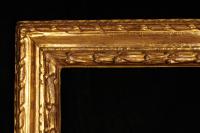 Italian, circa 1640, reverse section, carved and gilded frame with imbricated laurel leaf and berry ornament