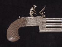 A rare flintlock pocket pistol with three barrels in line_b