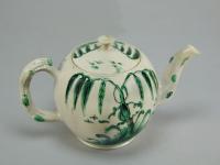 Staffordshire saltglaze teapot decorated in green and black, c.1770