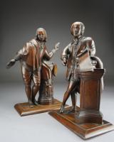 A pair of English carved walnut figures of Shakespeare and Milton, early 19th century