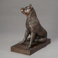 bronze sculpture of a seated dog