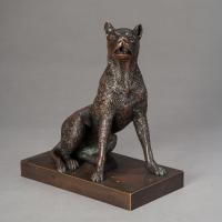 bronze sculpture of a seated dog