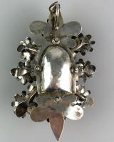 Floral silver gilt devotional pendant. Spanish Colonial, late 17th century