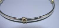 A Sterling Silver and 9ct Gold Bangle