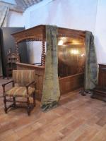 A mid-17th century, oak, tester, double bed with cupboard in the headboard, retaining its original iron fasteners, reputedly fro