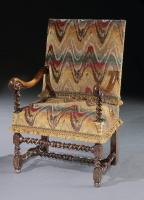 A Flemish, mid-17th century, walnut, open armchair upholstered in a re-created bargello with custom-made passmenterie