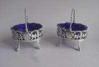 An extremely rare pair of early George III Cast "Basket" Salt Cellars made in London in 1770 by Robert & David Hennell.