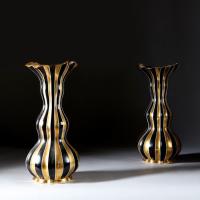A PAIR OF NAPOLEON III BLACK AND GOLD VASES