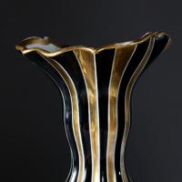 A PAIR OF NAPOLEON III BLACK AND GOLD VASES