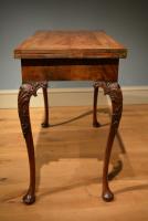A fine George II walnut concertina action card table