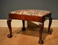 A large George II cherry wood stool