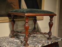 A rare 18th Century carved mahogany Kentian stool