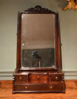  A high quality George II mahogany box toilet mirror having the rare feature of a carved cresting.