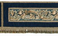 An 18 ft 6 ½ in long, early-20th century, pelmet with 19th century, Brussels, tapestry panels from Cowdray park, supplied circa 