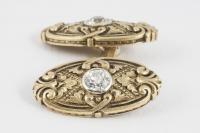 Cufflinks with Carved Scrolls in 14 Karat Gold with Central Diamond, American circa 1920