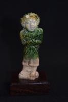 Tang dynasty (618-906)  Figure of a forigner covered in a green glaze