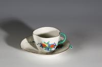 A Chantilly Kakiemon Peach-Shaped Cup and Saucer
