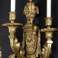 A Set of Four Large Louis XVI Style Three Branch Wall Appliques