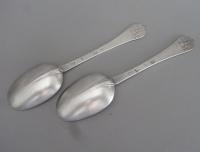 An extremely fine pair of William III Britannia Standard Trefid Spoons made in London in 1698 by Seth Lofthouse