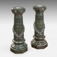 An unusual pair of Victorian marble revolving topped pedestals