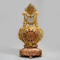 A Napoleon III Lyre clock with ormolu hands
