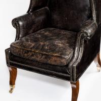 An unusual Regency mahogany sabre leg arm chair